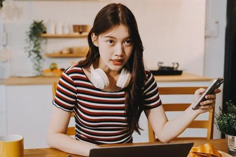 Asian woman using computer remote for business studying, watching online vi.. Stock Photos