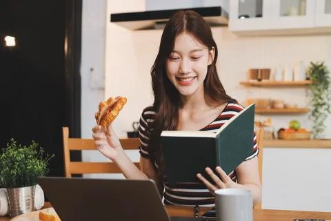 Asian woman using computer remote for business studying, watching online vi.. Stock Photos