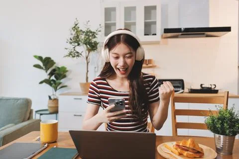 Asian woman using computer remote for business studying, watching online vi.. Stock-Fotos