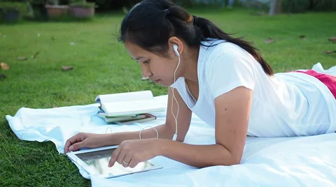 Asian woman using digital tablet outdoor. Stock Footage 56150127