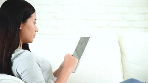 Asian woman using digital tablet shopping online, call, texting message internet Vidéo 159845576