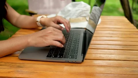 Asian woman using labtop to work in the garden at home. Stock Footage 206078112