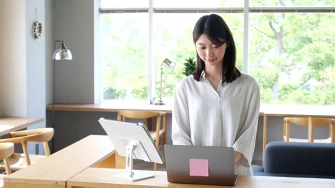 Asian Woman Using Self Check-In Kiosk at Modern Hotel Stock-Footage 344092347