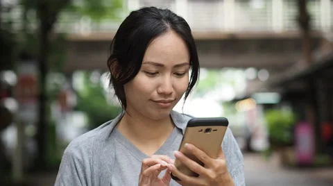 Asian woman using smartphone Stock-Footage 64229682