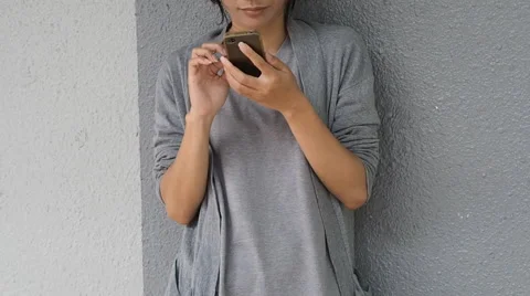 Asian woman using smartphone Stock Footage 64229857
