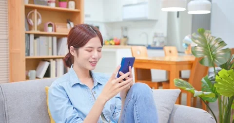 Asian woman using smartphone Stock Footage 156075813