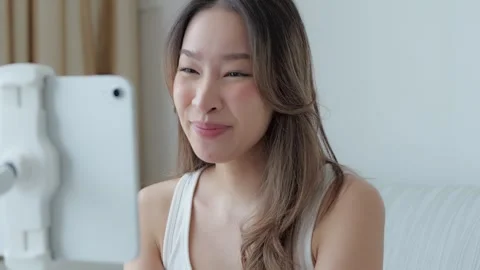 Asian Woman Using Tablet for Video Call at Home Vidéo 343850243