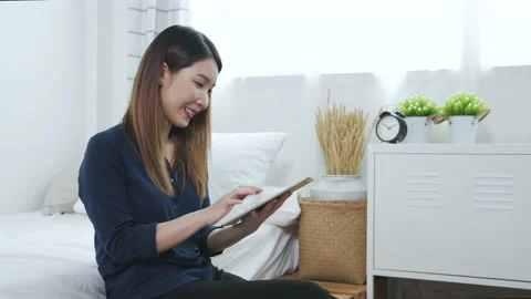 Asian woman using tablet working or making online shopping at home Video stock 151236155