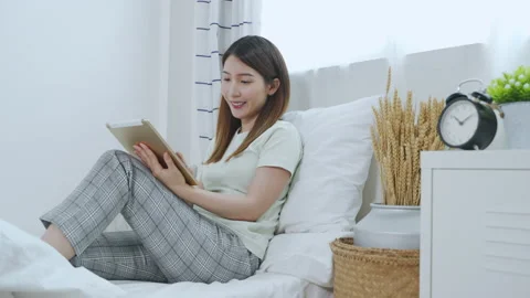 Asian woman using tablet working or making online shopping at home Video stock 151237643