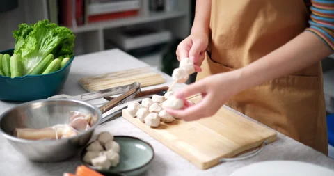 Asian woman wearing glasses preparing ingredients for cooking. Stock-Footage 320446953