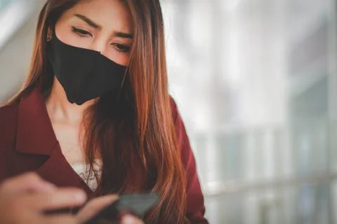 Asian woman wearing mask for protect pm2.5 and cough with Covid-19 virus outb Stock Photos