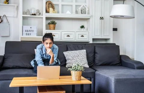 Asian woman work by using the computer laptop to make money from online business Stock Photos