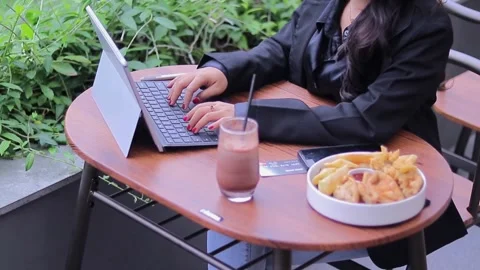 Asian woman working inputting data into a tablet gadget Stock Footage 265068809