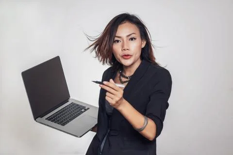 Asian women are standing talking with Mobile, laptop computer Stock Photos