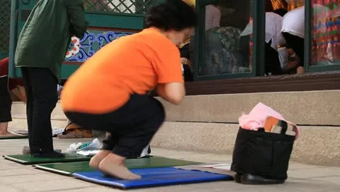 Asian women bowing down to pray Buddha in temple Stock Footage 11240407