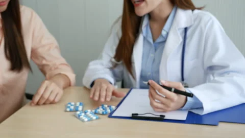 Asian women doctors using stethoscope listen respiratory rate Stock Footage 326282920