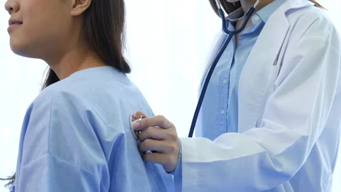 Asian women doctors using stethoscope listen respiratory rate Stock Footage 326282961