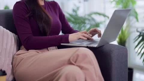 Asian women freelancer remote work using laptop computer on sofa typing bus.. Stock Footage 334358580