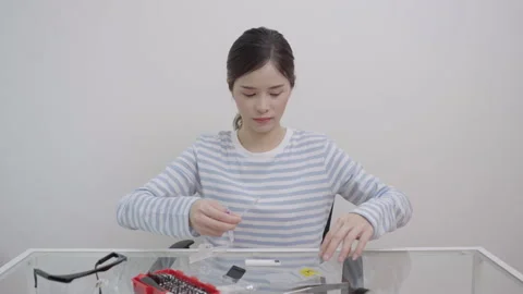 Asian wonman using rapids self-test of antigens COVID-19. Stock Footage 171400664