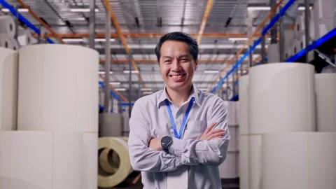 Asian Worker Acrossing His Arm at Polymer Plant Stock Footage 334523023