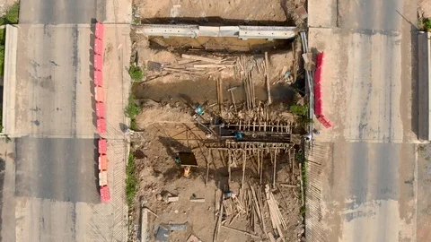Asian worker building bridge over water canal Stock Footage 88645164