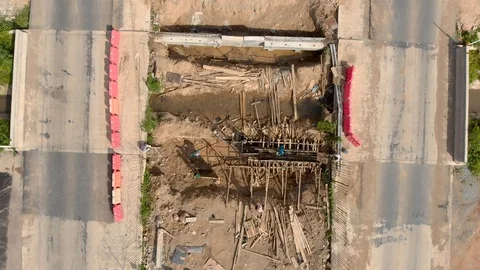 Asian worker building bridge over water canal Stock Footage 88645324