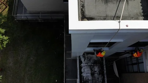 Asian worker cleaning high building windows glass Stock Footage 117291817