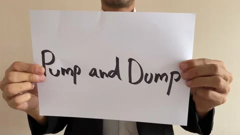 Asian worker crumpling paper message “Pump and Dump” then throw away Stock Footage 182285361