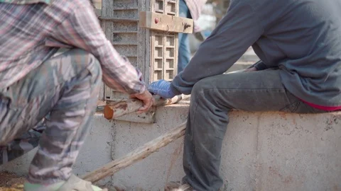 Asian worker labor building and balancing wooden cover for house pile Stock Footage 88124613