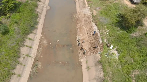 Asian worker labor building concrete public canal Stock-Footage 89556465