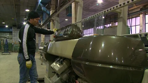 Asian worker man pushing buttons on machine for glass edge processing Stock Footage 76463459