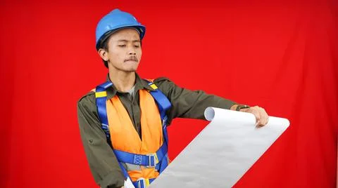 Asian worker man wearing uniform, helmet, safety harness and view  paper proj Stock Photos