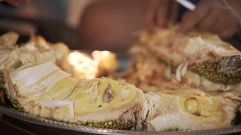Asian worker ripping raw jackfruit Stock Footage 127368115