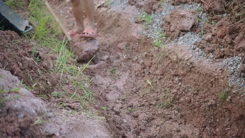 Asian worker using a hoe for digging canal Video stock 92793870