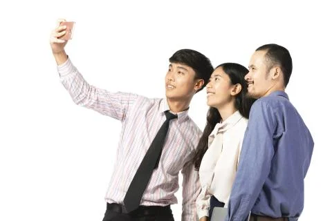 Asian worker using mobile phone take a photo  over white. Stock Photos