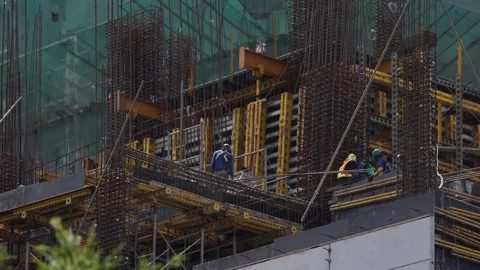 Asian Workers Lifting Materials With A Construction Crane Stock Footage 165290821