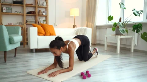Asian yoga instructor talk about plank pose while looking at camera. Asian sport Stock Footage 156755501