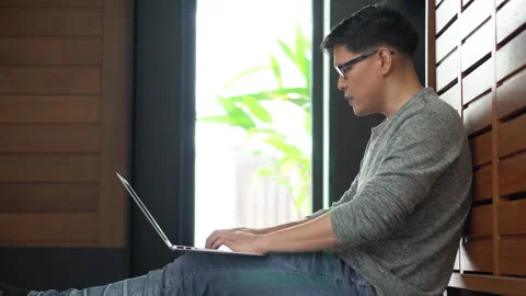 Asian young business man using laptop video conference talking to colleagues Stock Footage 158790258