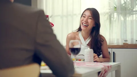 Asian young couple having dinner to celebrate valentine's day together. Stock Footage 171264355