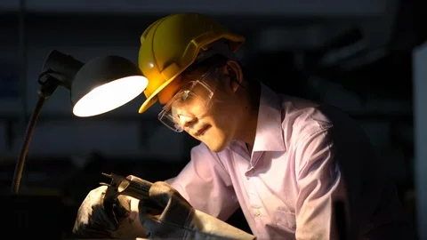 Asian young engineer working and using tools measurement quality of metal parts. Stock Footage 93604128