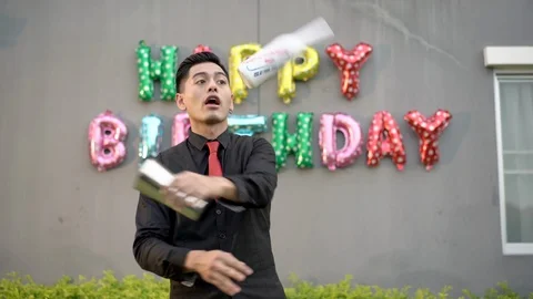 Asian young man bartender warming up before working with shaker. Stock Footage 123328320