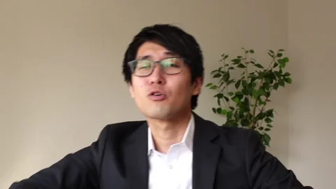 Asian young man dancing and pretending to be a hip hop rapper or singer. Stock Footage 248528326