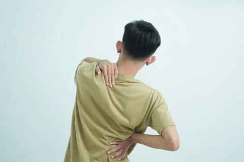 Asian young man feeling pain on his body, neck and back hurt or injury. Isolated Stock Photos