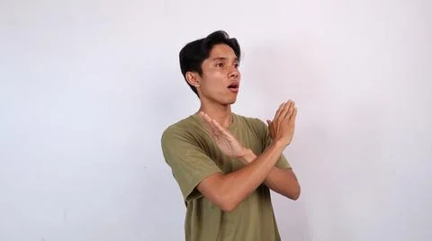 Asian young man gesturing with both hands crossed, rejection Foto stock