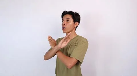 Asian young man gesturing with both hands crossed, rejection Stock Photos