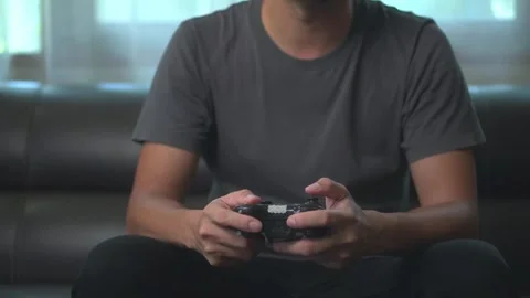 .Asian young man having fun playing video games sit sofa at home.Asian youn.. Stock-Footage 246853564