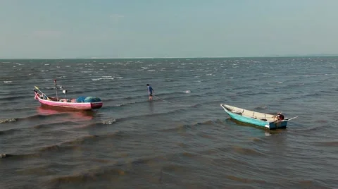 Asian young man pulling the boat anchors, Gulf of Thailand, the work. Stock Footage 46229853