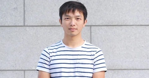 Asian young man smile to camera Stock Footage 84029928