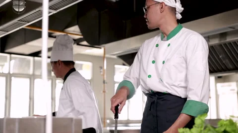 Asian Young man training to be chef for small business studying how to prep.. Stock Footage 245088684