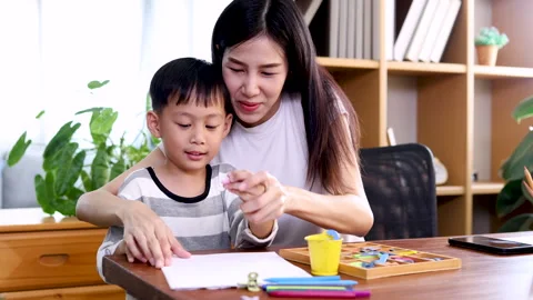Asian young mother multitask playing with kid boy while working on laptop, .. Stock Footage 246310364